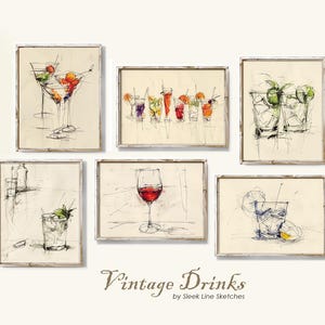 May include: A collection of six framed art prints featuring pen and ink sketches of various cocktails and drinks. The artwork includes martini glasses, wine glasses, and other beverage presentations, with fruit garnishes. The text "Vintage Drinks" is visible.