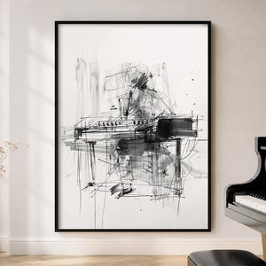 May include: Black and white abstract art print of a piano and pianist. The artwork is framed in a black frame and depicts the piano and pianist with bold brushstrokes and lines. The print is displayed in a well-lit room.