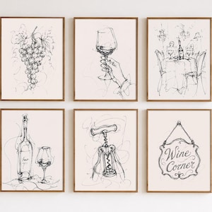May include: A collection of six framed art prints, each displaying a black and white sketch related to wine. The images include a bunch of grapes, a wine glass, a dining scene, a bottle, a corkscrew, and a "Wine Corner" sign.