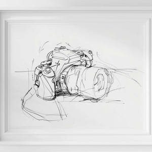 May include: Black and white sketch of a digital SLR camera with a lens. The artwork is framed in a white rectangular frame. The camera is drawn with fine lines, capturing its details.