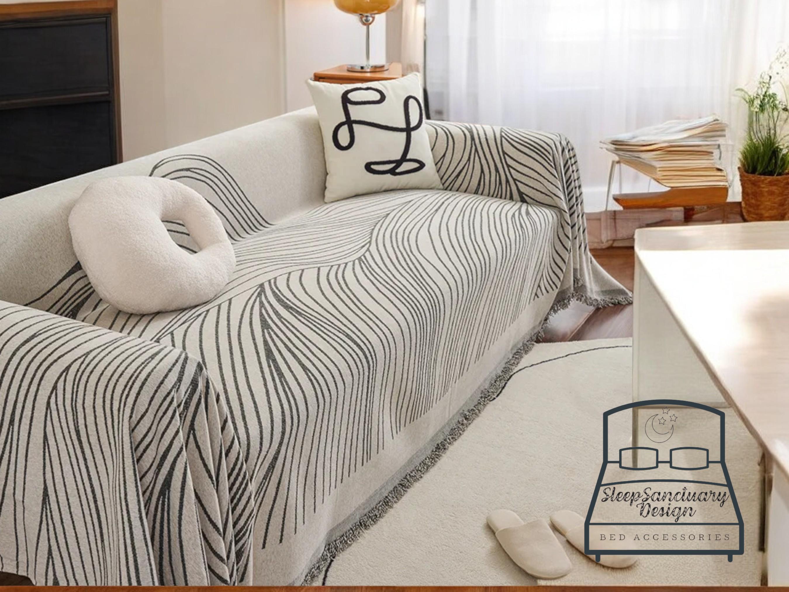 Covering a couch with a blanket sale