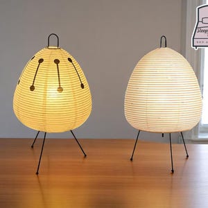 Lámpara de mesa de ambiente suave / Linterna de papel moderna / Decoración minimalista para dormitorio / Luz nocturna LED cálida / Iluminación portátil y ligera