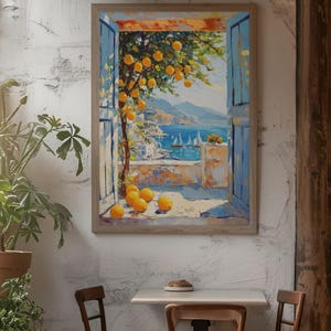 May include: A framed painting depicts a coastal scene with a window view. The painting shows a tree with yellow fruit, blue shutters, and a view of the sea with sailboats. The painting is displayed on a textured white wall, with a table and chairs in front.