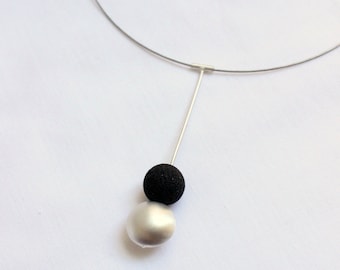 Magma Necklace made of Matte sterling silver, simple and contemporary design to wear all day, long  and lightweight.