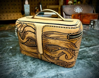 Leather case with engraved tentacles that could be used as a dopp travel kit, tobacco case or for anything you would like to store in it