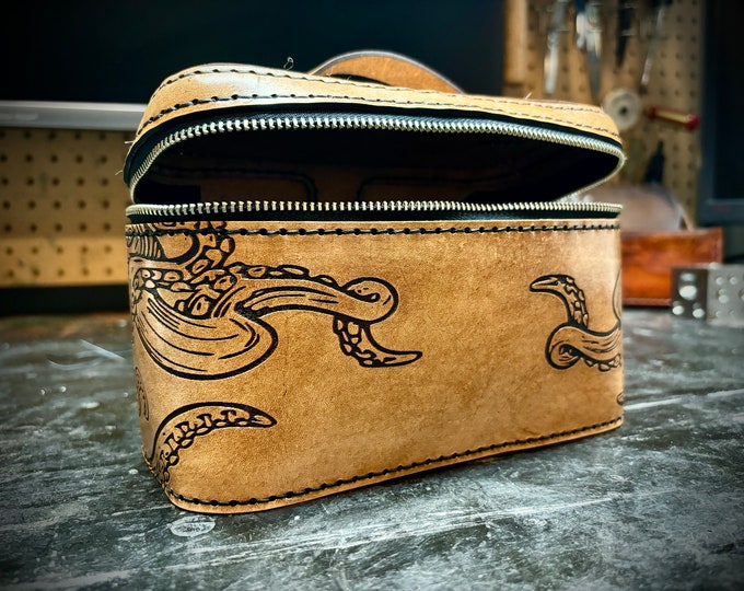 Leather case with engraved tentacles that could be used as a dopp travel kit, tobacco case or for anything you would like to store in it