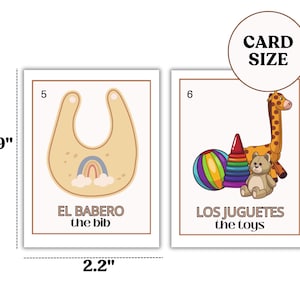 May include: Two illustrated flashcards for teaching Spanish to children. The first card shows a yellow bib with a rainbow and clouds and the text "EL BABERO the bib". The second card shows a giraffe, a teddy bear, a ball, and a stacking toy with the text "LOS JUGUETES the toys".