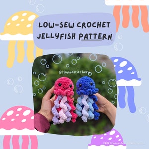 May include: Two crocheted jellyfish toys, one pink and one blue, with a smiling face and a swirl of colors for the tentacles. The toys are held in the hands of a person. The image has the text "LOW-SEW CROCHET JELLYFISH PATTERN" and "@Hayyastitchery".
