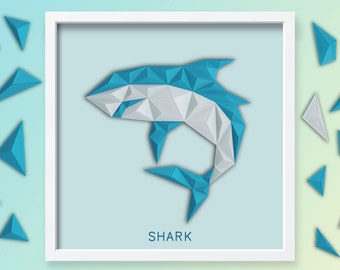 May include: A white frame with a blue and white geometric shark design inside. The word "SHARK" is printed below the shark. The frame is surrounded by small blue and white geometric triangles.