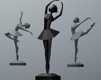 May include: Three geometric ballerina sculptures in shades of grey and black. Each figure is posed in a different ballet position, with tutus and bases. The background is a solid grey.
