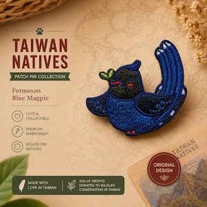 May include: An embroidered patch pin of a Formosan Blue Magpie, featuring a black head, deep blue wings and tail, and a small green leaf in its beak. The text on the display card reads TAIWAN NATIVES PATCH PIN COLLECTION and Formosan Blue Magpie.