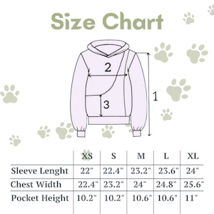 Op de afbeelding: Maattabel voor een hoodie met maten in inches voor mouwlengte, borstbreedte en zakhoogte. De maten omvatten XS, S, M, L en XL.