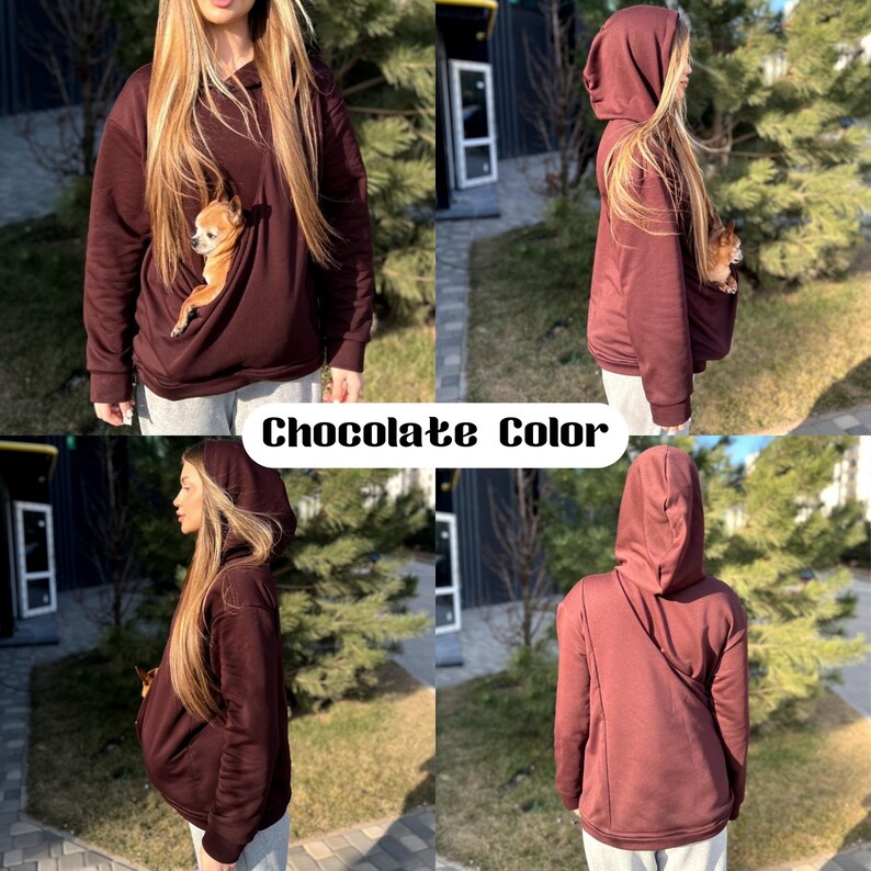 Op de afbeelding: Een chocoladebruine hoodie met een zakje aan de voorkant voor een klein huisdier. De hoodie heeft een capuchon met trekkoord en lange mouwen.