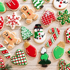 May include: A collection of assorted Christmas-themed sugar cookies decorated with colorful icing. Shapes include gingerbread people, snowmen, candy canes, Christmas trees, mittens, hearts, and light bulbs in red, green, white, and brown.