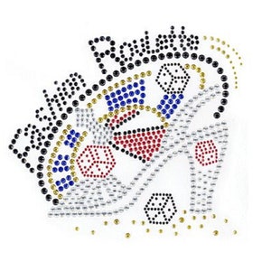 May include: A rhinestone design featuring a high heel shoe, dice, and the word "Roulette" in black rhinestones. The design is on a white background.