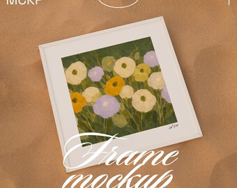 Square 1x1 Art Poster Mockup: white frame on the sand artwork template (PSD + JPG files)