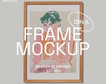 May include: A framed art print mockup with a light wood frame. The artwork features a person with green hair and a pink shirt. The image includes the text "FRAME MOCKUP" and "3000px X 3000px - 300 dpi".