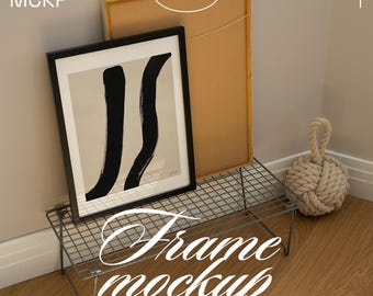 May include: A framed art print with black brushstrokes on a beige background, displayed on a wire rack. The words "Frame mockup" and "compatible with Photoshop, Photopea & Affinity" are visible. A decorative rope ball is also present.