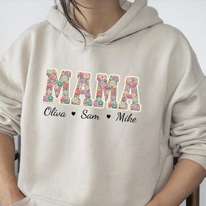 May include: A set of three ceramic mugs with a speckled, matte finish. The mugs are in shades of cream, light gray, and dark gray. Each mug has a simple, minimalist design and a rounded handle. Perfect for coffee or tea.