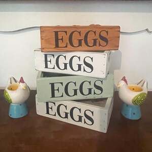 May include: A rustic wooden sign with the text "Welcome to our home" in a handwritten style. The sign features a distressed finish and a simple, inviting design, perfect for a front porch or entryway.