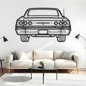 May include: Black metal wall art depicting the rear view of a classic car. The artwork features detailed outlines of the car's body, including the taillights, bumper, and license plate area. The car is mounted on a white wall above a white sofa.