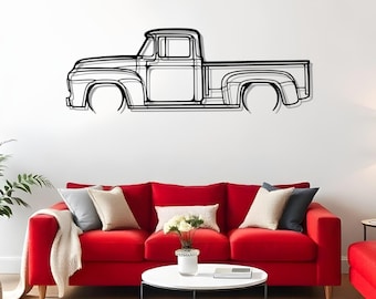 Silueta metálica de un Ford F100 de 1956 para la decoración de la cueva del hombre.