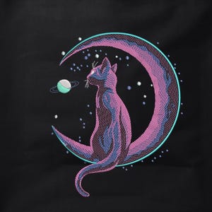 May include: A black cat sits on a pink crescent moon with a teal outline. The moon is surrounded by a field of white stars against a black background. A small teal planet with a white ring orbits the moon.