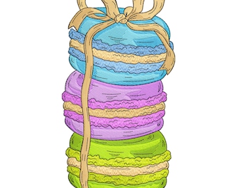 May include: A stack of three embroidered macarons in blue, purple, and green, tied with a tan ribbon. The macarons have a textured appearance, with a light yellow filling visible between the layers. The image is on a white background.