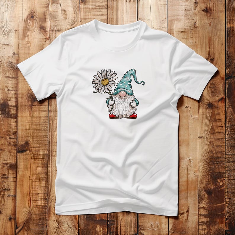 May include: White t-shirt with a cartoon gnome holding a daisy. The gnome is wearing a blue and white polka dot hat and red shoes.
