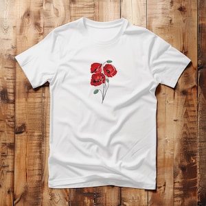 May include: White t-shirt featuring a detailed illustration of three red poppies with green stems and leaves. The floral design is centered on the chest. The shirt is made of a soft, lightweight fabric.