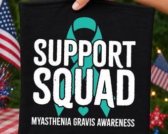 May include: A black fabric square featuring a teal awareness ribbon graphic centered behind the white text "SUPPORT SQUAD" and the smaller white text "MYASTHENIA GRAVIS AWARENESS" at the bottom, with a small teal heart icon above the bottom text.