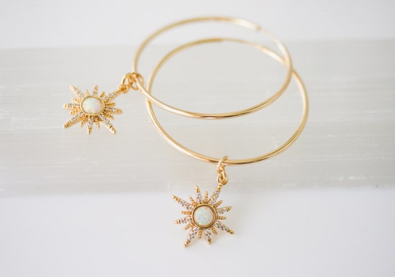 Gold Hoop Earrings with Starburst Charm