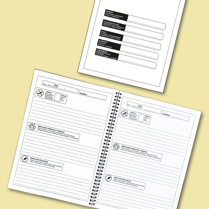 May include: Two white spiral-bound notebooks with black text and line drawings. One notebook is open, displaying lined pages with sections for labor, spare parts, and notes. The other notebook has sections for owner, license plate, VIN, engine, and gearbox.