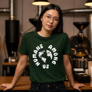 May include: A rustic wooden sign with the text "Welcome to our home" in white lettering. The sign features a distressed finish and a simple, inviting design, perfect for a front porch or entryway.