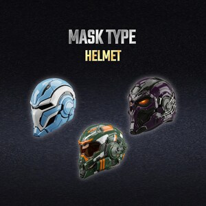 K&ouml;nnte beinhalten: Drei futuristische Helme mit der Aufschrift MASK TYPE HELMET. Einer ist hellblau und wei&szlig;, einer ist dunkelviolett mit leuchtend orangen Augen und einer ist gr&uuml;n und orange mit einem dunklen Visier. Die Helme zeigen komplexe mechanische Details.