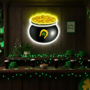 May include: A St. Patrick's Day themed bar scene. A neon sign depicts a black pot filled with gold coins, a horseshoe, and a shamrock. Green hats and glasses of dark beer sit on the bar. The sign says "Lucky Charm".