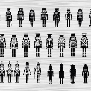 Puede incluir: Una colección de 20 figuras de cascanueces de silueta negra en varias poses. Los cascanueces llevan todos sombreros y uniformes tradicionales.