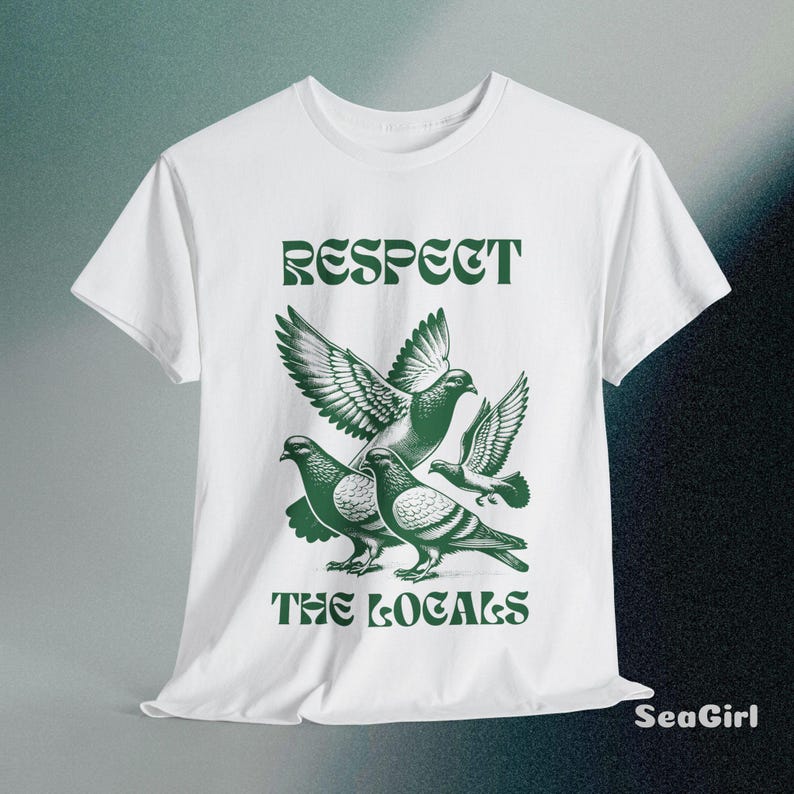 May include: White t-shirt with a green graphic of pigeons and the text "RESPECT THE LOCALS".