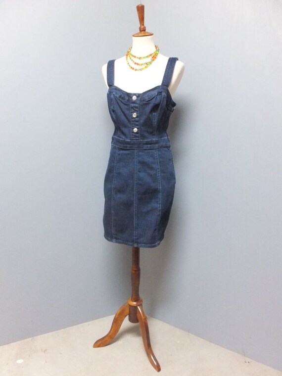 fitted denim pencil dress Caramel Dark denim pencil dress @thevaultbysacha very stretchy Tube top pencil dress back zipper back split Style tip: pair with your favorite choker or necklace. Wear with white collar shirt to