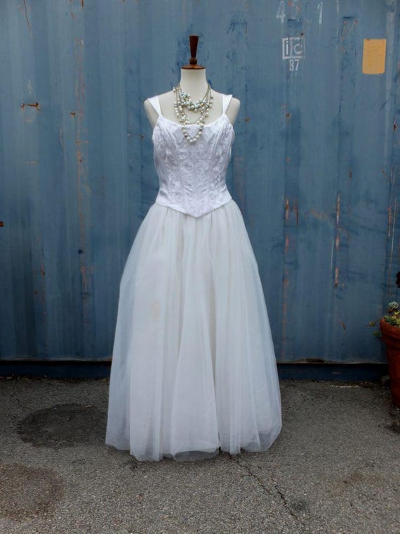 white wedding dress on mannequin a Stock Photo Length Fabric Wedding dress on a mannequin.
