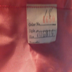 May include: A white tag with black text that reads "Order No. ____ Style ____ Size ____ Remarks" with the numbers 4650 and 704814 filled in.
