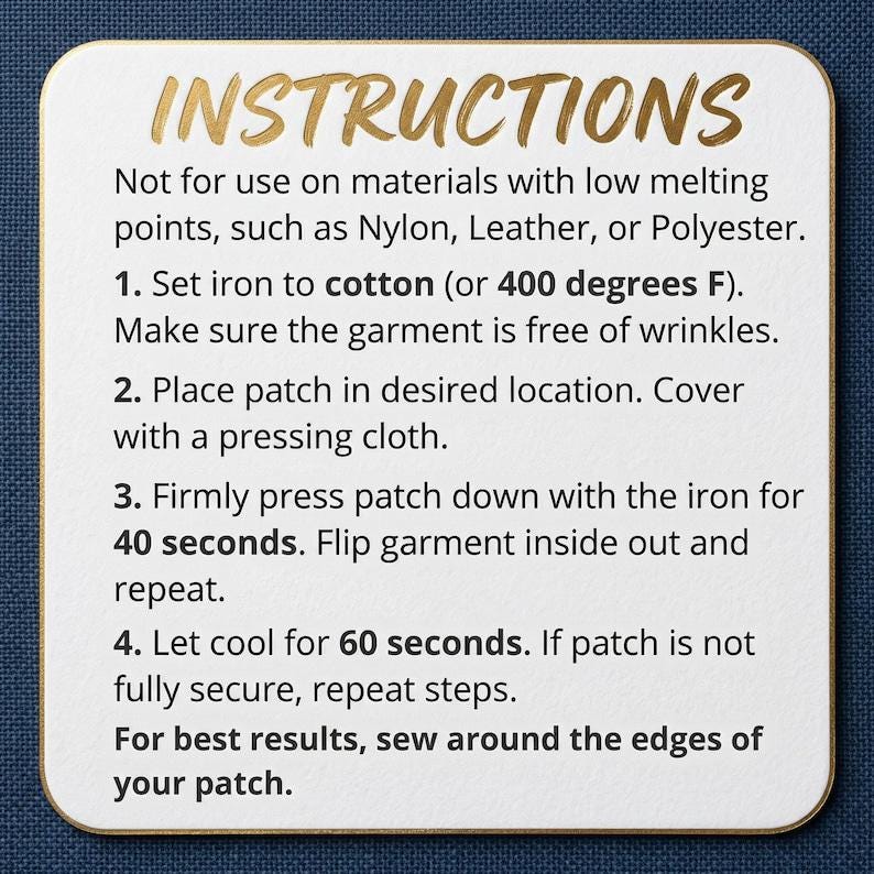 May include: A white square card with rounded corners, featuring gold text that reads "INSTRUCTIONS." The card provides detailed steps for applying a patch with an iron, including temperature and time guidelines. The background is a dark blue fabric.