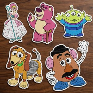 トイ・ストーリー刺繍パッチセット、ディズニー漫画キャラクターパッチ、ボー・ピープ、ロッツォ、エイリアン、スリンキー・ドッグ、ミスター・ポテトヘッドのアイロン接着・縫い付けパッチ