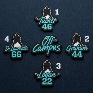May include: A selection of black and teal hockey-themed patches. Each patch features a hockey player silhouette, a name, and a number. The patches include the names "Tucker", "Graham", "Logan", and "Di Laurentis", along with the text "Off Campus".