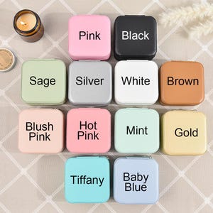 May include: Twelve small square boxes with different colors and labels. The labels include: Pink, Black, Sage, Silver, White, Brown, Blush Pink, Hot Pink, Mint, Gold, Tiffany, and Baby Blue.