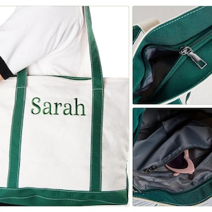 May include: White canvas tote bag with green trim and handles. The name "Sarah" is embroidered in green on the front. Features a zippered top and interior pocket. Perfect for carrying essentials.