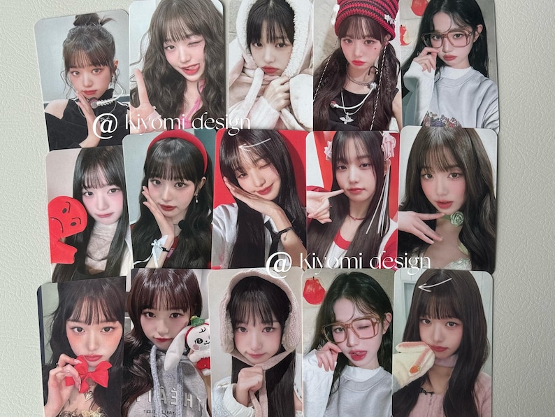 May include: A set of trading cards displaying portraits of a young woman in diverse styles. The cards have a glossy finish and feature the text "@ kivomi design". The backgrounds vary, including red and white. The cards are likely for collecting.
