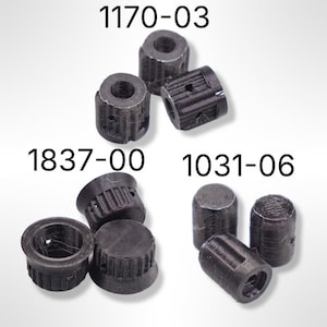 May include: A collection of black, cylindrical components with various designs. The image includes components labeled "1170-03", "1837-00", and "1031-06". The components have a textured appearance and appear to be 3D-printed.