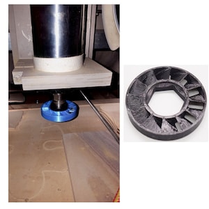 May include: A close-up of a blue and black 3D printed object with a hexagonal center. The object is attached to a metal rod and is being used on a CNC machine.