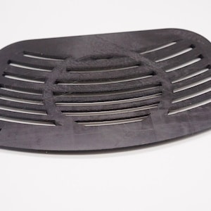 May include: Black plastic filter with a grid pattern and the word "PUSH" on both sides.